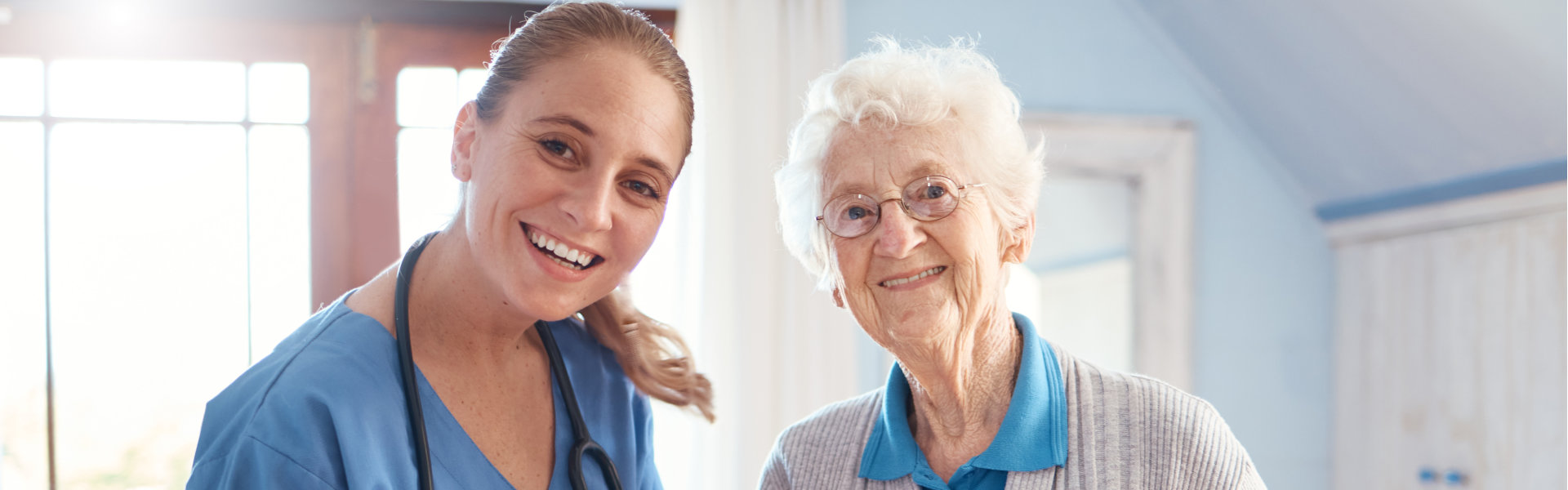 nurse with a erderly woman after medical consultation in a nursing facility